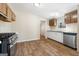 Well-lit kitchen equipped with essential appliances and ample cabinet space, ready for culinary adventures at 261 Lakeview Dr, Locust Grove, GA 30248