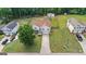Aerial view of a house, driveway, lawn, and surrounding neighborhood at 227 River Trace Ct, Mcdonough, GA 30253