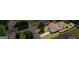 Aerial shot of a property with a pool and gazebo nestled within a well-maintained, verdant neighborhood at 227 River Trace Ct, Mcdonough, GA 30253
