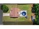 An aerial view of a home with a large backyard featuring an above-ground pool with slide, a gazebo, and fenced yard at 227 River Trace Ct, Mcdonough, GA 30253