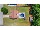 An aerial view of a home with a large backyard featuring a pool, a gazebo, and fenced yard at 227 River Trace Ct, Mcdonough, GA 30253