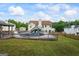 Lovely backyard featuring an inground pool, large deck, and home exterior view at 227 River Trace Ct, Mcdonough, GA 30253