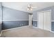 This spacious bedroom offers a ceiling fan with light fixture, and large closet at 227 River Trace Ct, Mcdonough, GA 30253