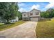 Charming two-story home with a spacious driveway and a well-maintained front yard at 227 River Trace Ct, Mcdonough, GA 30253