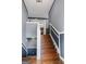 View of the home's staircase featuring wood stairs, white railings, and gray walls at 227 River Trace Ct, Mcdonough, GA 30253