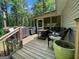 Outdoor deck with seating and grill area, perfect for entertaining and enjoying the outdoor scenery at 324 Bells Ferry Ne Rd, White, GA 30184