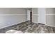 Neutral bedroom featuring wood-look floors, fresh paint, and white trim and doors at 36 Highpoint Ln, Locust Grove, GA 30248