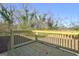 View of home's wooden deck area, ideal for outdoor entertaining, with railings and natural wood finish at 36 Highpoint Ln, Locust Grove, GA 30248