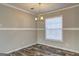 Dining room featuring a modern chandelier and a bright window at 36 Highpoint Ln, Locust Grove, GA 30248