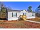 Charming home with gray siding, a well-maintained front yard, and a welcoming entrance at 36 Highpoint Ln, Locust Grove, GA 30248