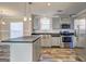Well-lit kitchen with stainless steel appliances and center island at 36 Highpoint Ln, Locust Grove, GA 30248