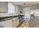 Modern kitchen with stainless steel appliances, farmhouse sink, and granite countertops at 36 Highpoint Ln, Locust Grove, GA 30248