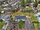 Drone shot of the home with fenced yard and beautiful trees at 152 Skyland E Dr, Locust Grove, GA 30248