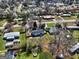 Aerial shot of the house nestled in a friendly neighborhood, surrounded by green spaces and mature trees at 152 Skyland E Dr, Locust Grove, GA 30248