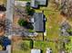 A top-down aerial view of a home showcasing its backyard, fencing, and proximity to neighboring properties at 152 Skyland E Dr, Locust Grove, GA 30248