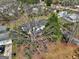 An aerial view of the house, nestled among mature trees, with a well-maintained yard and inviting outdoor spaces at 152 Skyland E Dr, Locust Grove, GA 30248