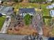 Aerial view of the home in its serene surroundings, showcasing a well-manicured yard and a quiet neighborhood at 152 Skyland E Dr, Locust Grove, GA 30248