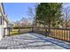 The back deck is made of gray planks and showcases a gray railing at 152 Skyland E Dr, Locust Grove, GA 30248