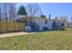 The home features a fenced yard, deck and covered porch at 152 Skyland E Dr, Locust Grove, GA 30248