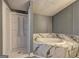 Bathroom showcasing a glass-enclosed shower and tub with marble tile at 152 Skyland E Dr, Locust Grove, GA 30248