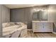 Bathroom with marble trim tub and vanity at 152 Skyland E Dr, Locust Grove, GA 30248
