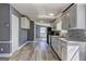 Updated kitchen featuring white cabinets, stainless steel appliances, and plenty of counter space at 152 Skyland E Dr, Locust Grove, GA 30248