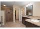 Bathroom featuring double vanity with granite countertop and a walk in shower at 166 Nobility Ln, Mcdonough, GA 30252