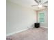 Minimalist bedroom with carpeted floors, a ceiling fan, and natural light from the window at 166 Nobility Ln, Mcdonough, GA 30252