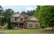 Charming two-story brick home with a well-manicured lawn and inviting curb appeal at 166 Nobility Ln, Mcdonough, GA 30252