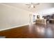 Spacious living area with an open layout, dark wood floors, and seamless access to the kitchen at 166 Nobility Ln, Mcdonough, GA 30252