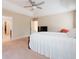 Main bedroom showcasing tray ceiling, fan, and large windows, with a tv on a dresser at 166 Nobility Ln, Mcdonough, GA 30252