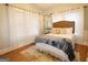 Bright bedroom with wood floors, large windows, and plush bedding at 997 Boulevard Se, Atlanta, GA 30312
