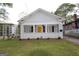 Charming home with a spacious front yard and white exterior at 997 Boulevard Se, Atlanta, GA 30312