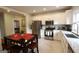 Bright kitchen with stainless steel appliances, white cabinetry, and a dining area at 997 Boulevard Se, Atlanta, GA 30312