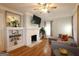 Cozy living room with a fireplace, built-in shelves, and hardwood floors at 997 Boulevard Se, Atlanta, GA 30312