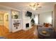 Open living room featuring fireplace, built-in shelving, and hardwood floors at 997 Boulevard Se, Atlanta, GA 30312