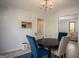 Inviting dining area with stylish chairs, chandelier, and convenient access to other rooms, perfect for gatherings at 2889 Carrousel Ct, Stone Mountain, GA 30087