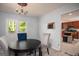 Bright dining room with a view, modern lighting, and easy access to the kitchen, enhancing the dining experience at 2889 Carrousel Ct, Stone Mountain, GA 30087