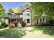 Charming two-story home with a welcoming front porch and well-maintained lawn, perfect for a Gathering at 2889 Carrousel Ct, Stone Mountain, GA 30087