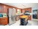 Functional kitchen with wood cabinets, stainless steel appliances, and granite countertops offers space for cooking at 2889 Carrousel Ct, Stone Mountain, GA 30087