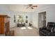 Living room showcasing a brick fireplace, bay window, and ample natural light at 2889 Carrousel Ct, Stone Mountain, GA 30087