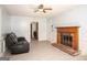 Inviting living room featuring a cozy fireplace and ample seating space at 2889 Carrousel Ct, Stone Mountain, GA 30087