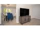 Open-concept living area adjacent to the dining room, featuring modern flooring, and a media center at 2889 Carrousel Ct, Stone Mountain, GA 30087