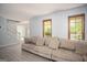 Bright living room featuring a large sofa and hardwood floors at 2889 Carrousel Ct, Stone Mountain, GA 30087