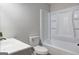 Bathroom features a sleek vanity, a pristine toilet, and a shower-tub combo at 7279 Mayfair Cir, Jonesboro, GA 30236