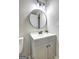 Bathroom featuring vanity, sink, mirror, and modern lighting at 7279 Mayfair Cir, Jonesboro, GA 30236