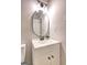 Updated bathroom featuring vanity, sink, mirror, and modern lighting at 7279 Mayfair Cir, Jonesboro, GA 30236