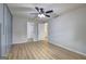 Bedroom features ceiling fan, sleek floors, and a direct view into other rooms at 7279 Mayfair Cir, Jonesboro, GA 30236