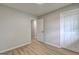 Bedroom with wood floors, closet and view into hallway at 7279 Mayfair Cir, Jonesboro, GA 30236