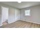 Bedroom with wood floors, closet and view into bathroom at 7279 Mayfair Cir, Jonesboro, GA 30236